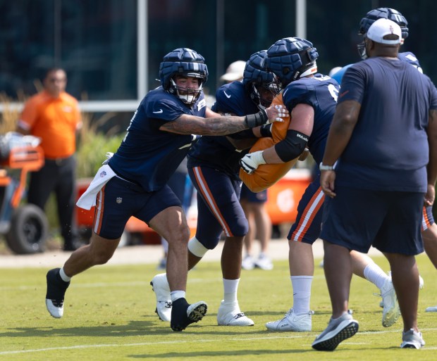 Bears guard Ryan Bates faces off against offensive tackle Theo Benedet during training camp on July 26, 2024. (Stacey Wescott/Chicago Tribune)