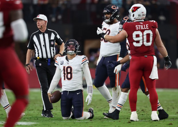 Chicago Bears quarterback Caleb Williams (18) gets up after being sacked by the Arizona Cardinals in the second quarter Sunday, Nov. 3, 2024, at State Farm Stadium in Glendale, Arizona. (Brian Cassella/Chicago Tribune)