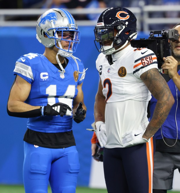 Lions wide receiver Amon-Ra St. Brown (14) and Bears wide receiver DJ Moore (2) talk during warmups at Ford Field on Nov. 28, 2024, in Detroit. (John J. Kim/Chicago Tribune)