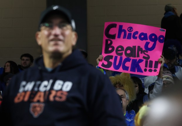 A Lions fan holds a poster mocking the Bears before the game at Ford Field on Nov. 28, 2024, in Detroit. (John J. Kim/Chicago Tribune)