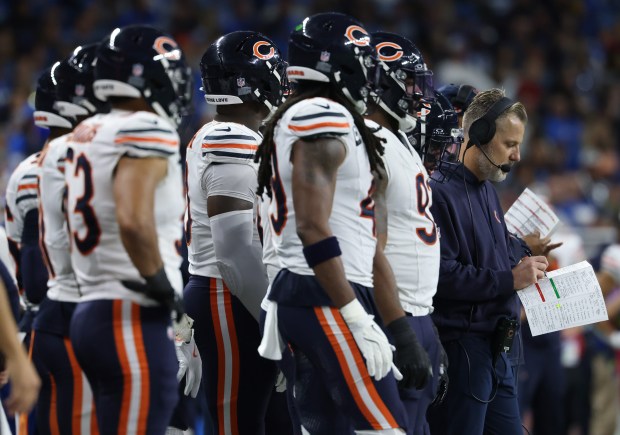 Bears coach Matt Eberflus writes on a play sheet in the third quarter Lions at Ford Field on Nov. 28, 2024, in Detroit. (John J. Kim/Chicago Tribune)