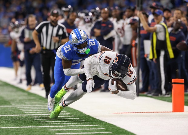 Bears wide receiver Keenan Allen makes a reception near the end zone as Lions cornerback Amik Robertson covers on the final drive of the game at Ford Field on Nov. 28, 2024, in Detroit (John J. Kim/Chicago Tribune)