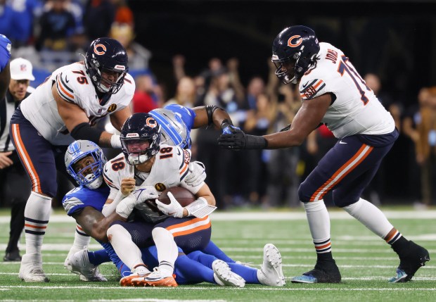 Bears quarterback Caleb Williams (18) is sacked by Lions defensive end Za'Darius Smith (99) on the second to the final play of the game at Ford Field on Nov. 28, 2024, in Detroit. With no timeouts left, Williams was forced to throw a Hail Mary to the end zone for the final play in a 23-20 loss. (John J. Kim/Chicago Tribune)