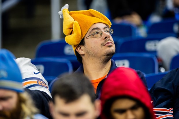 A fan watches as Bears players warm up before the Bears play against the Lions at Ford Field in Detroit on Nov. 28, 2024. (Tess Crowley/Chicago Tribune)