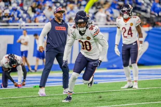 Bears safety Tarvarius Moore (30) warms up before the Bears play against the Lions at Ford Field in Detroit on Nov. 28, 2024. (Tess Crowley/Chicago Tribune)