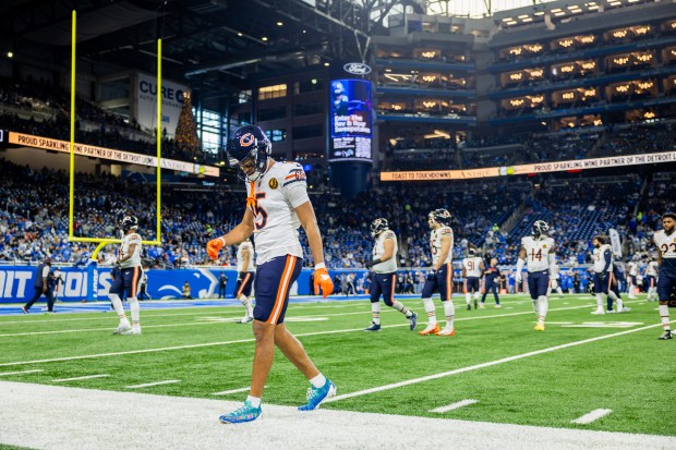 Bears wide receiver Rome Odunze (15), left, warms up before the Bears play against the Lions at Ford Field in Detroit on Nov. 28, 2024. (Tess Crowley/Chicago Tribune)