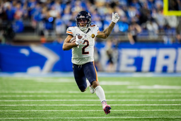 Bears wide receiver DJ Moore runs the ball during the fourth quarter against the Lions at Ford Field in Detroit on Nov. 28, 2024. (Tess Crowley/Chicago Tribune)