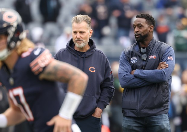 Bears coach Matt Eberflus, left, talks with former player Charles Tillman before a game against the Packers at Soldier Field on Nov. 17, 2024. (John J. Kim/Chicago Tribune)