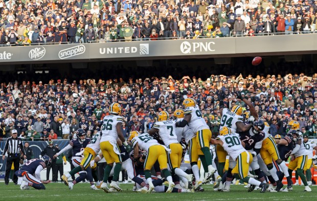 Bears place kicker Cairo Santos (8) kicks a 46-yard field goal attempt, which is blocked by Packers defensive end Karl Brooks (94), for a 20-19 loss at Soldier Field. (John J. Kim/Chicago Tribune)