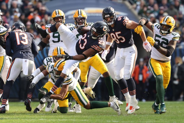 Bears running back Roschon Johnson is tackled by Packers cornerback Carrington Valentine in the third quarter at Soldier Field on Nov. 17, 2024. (John J. Kim/Chicago Tribune)