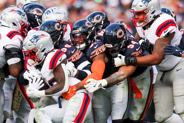 Chicago Bears defense tackle New England Patriots cornerback Alex Austin (28) during the third quarter at Soldier Field on Nov. 10, 2024. (Eileen T. Meslar/Chicago Tribune)