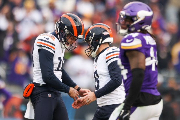 Bears punter Tory Taylor celebrates with kicker Cairo Santos after Santos kicked the game-tying field goal to send the game into overtime at Soldier Field on Nov. 24, 2024. (Eileen T. Meslar/Chicago Tribune)