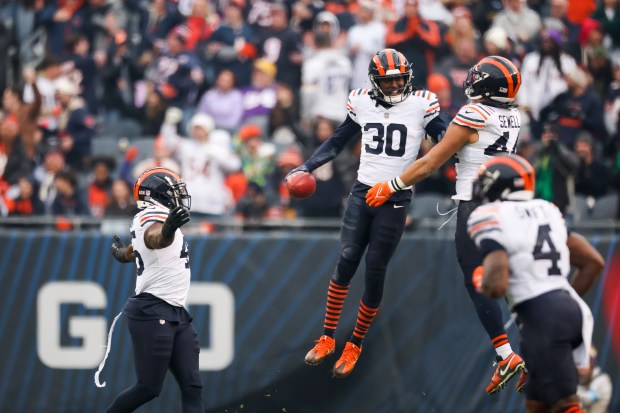 Bears safety Tarvarius Moore celebrates with teammates after recovering an onside kick during the fourth quarter against the Vikings at Soldier Field on Nov. 24, 2024. (Eileen T. Meslar/Chicago Tribune)