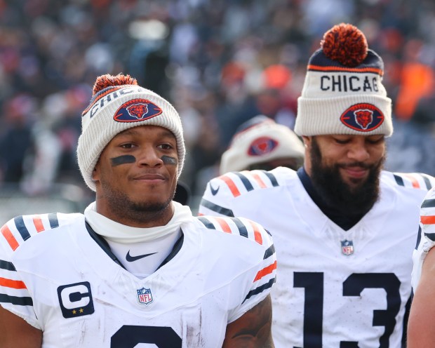 Bears wide receivers DJ Moore, left, and Keenan Allen head off the field at halftime against the Vikings on Nov. 24, 2024, at Soldier Field. (Stacey Wescott/Chicago Tribune)