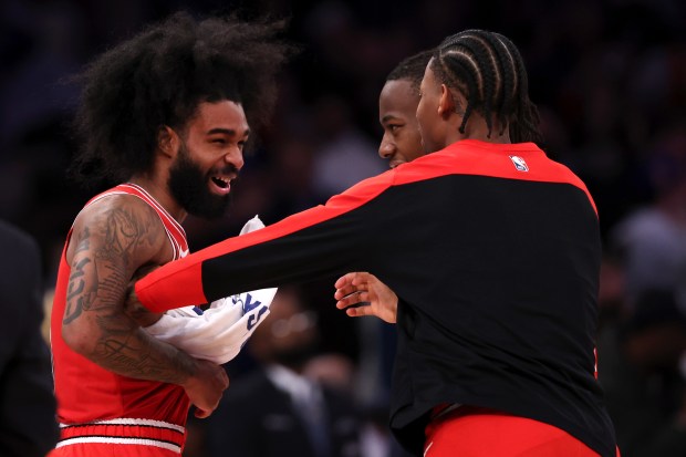 Bulls guard Coby White, left, celebrates with teammates after they defeated the Knicks at Madison Square Garden on Nov. 13, 2024, in New York. (Elsa/Getty Images)