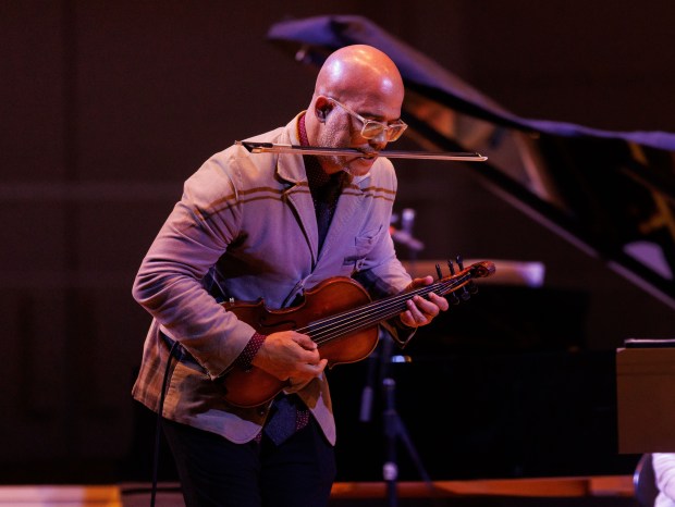 Violinist Daniel Bernard Roumain performs with members of the Chicago Symphony Orchestra and Conductor Kendrick Armstrong in the CSO MusicNOW series featuring Daniel Bernard Roumain (DBR): Voices of Migration & Innovation at the Chicago Symphony Center on Nov. 24, 2024. (Armando L. Sanchez/Chicago Tribune)