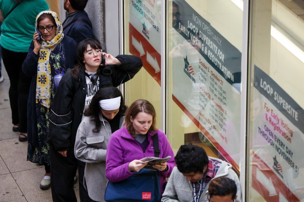 People stand in line to vote at the Board of Elections Loop Super Site on Nov. 4, 2024, during the last day of early voting. (Eileen T. Meslar/Chicago Tribune)