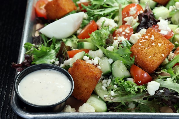 The mixed salad with cornbread croutons at Sanders BBQ Supply Co. on West 99th Street in Chicago, Nov. 21, 2024. (Terrence Antonio James/Chicago Tribune)