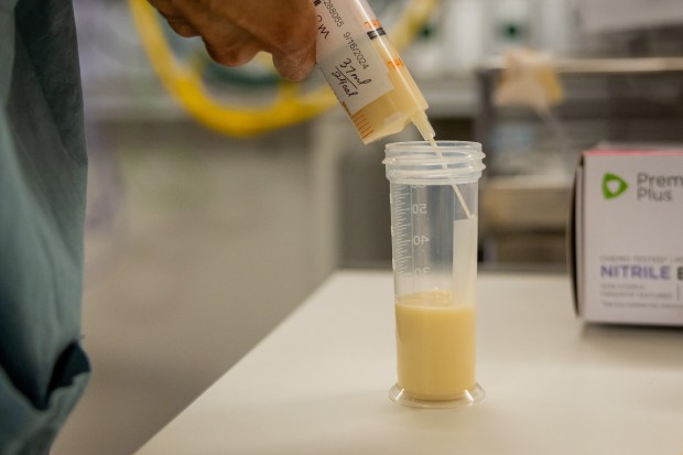 Breast milk is put into a bottle at Mount Sinai Hospital's Neonatal Intensive Care Unit in Chicago on Oct. 4, 2024. (Tess Crowley/Chicago Tribune)