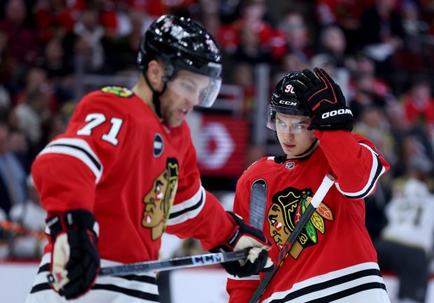 Blackhawks left wing Taylor Hall (71) and center Connor Bedard stand on the ice in the third period of the home opener against the Golden Knights on Saturday, Oct. 21, 2023, at the United Center. (Chris Sweda/Chicago Tribune)