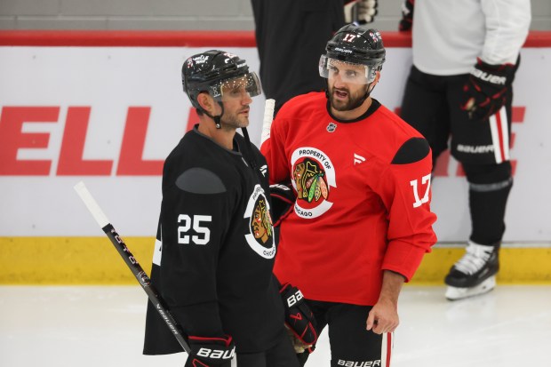 Chicago Blackhawks forward Nick Foligno (17) speaks to defenseman Alec Martinez (25) during the first day of training camp at Fifth Third Arena on Thursday, Sept. 19, 2024. (Eileen T. Meslar/Chicago Tribune)