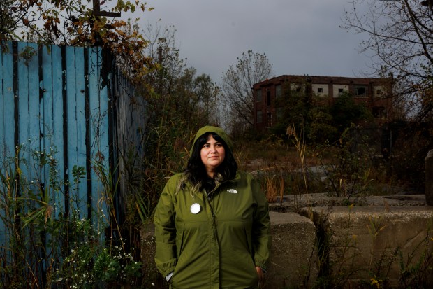 Gina Ramirez, midwest regional director of environmental health for the National Resources Defense Council, stands near the former Acme Steel plant in Chicago's South Deering neighborhood on Oct. 15, 2024. Ramirez successfully pushed the U.S. Environmental Protection Agency to add the former Acme Steel Coke Plant to the Superfund National Priorities List, making it eligible for more federal cleanup funds. The 104-acre plant is located just west of the Invert Chicago property. (Armando L. Sanchez/Chicago Tribune)