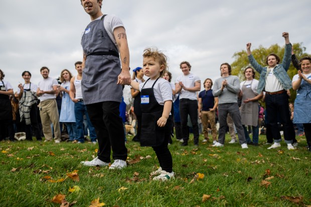 Massimo Morelli, 2, center, participates in a Jeremy Allen White lookalike competition at Humboldt Park in Chicago on Nov. 16, 2024. (Tess Crowley/Chicago Tribune)