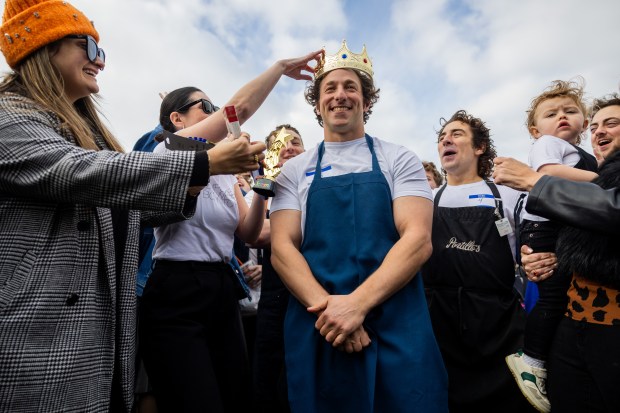 Ben Shabad is crowned winner in a Jeremy Allen White lookalike competition at Humboldt Park in Chicago on Nov. 16, 2024. Shabad won $50 and a pack of cigarettes. (Tess Crowley/Chicago Tribune)