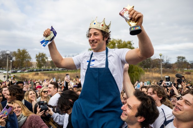 Ben Shabad is crowned winner in a Jeremy Allen White lookalike competition at Humboldt Park in Chicago on Nov. 16, 2024. Shabad won $50 and a pack of cigarettes. (Tess Crowley/Chicago Tribune)