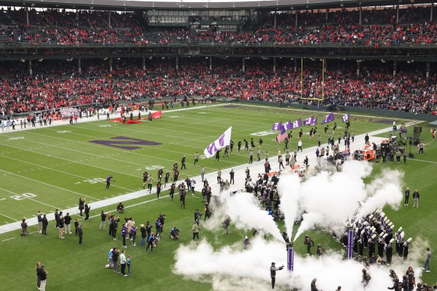 Northwestern players enter the field to play Ohio State at Wrigley Field on Nov. 16, 2024, in Chicago. (John J. Kim/Chicago Tribune)