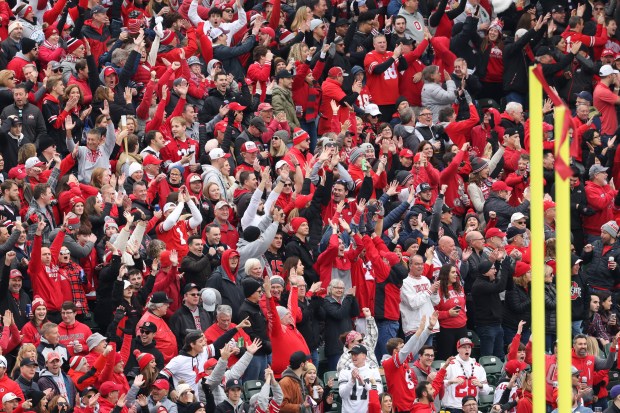 A majority Ohio State fan base cheers after a touchdown reception by wide receiver Jeremiah Smith in the first quarter against Northwestern at Wrigley Field on Nov. 16, 2024, in Chicago. The reception was overturned after video review. (John J. Kim/Chicago Tribune)