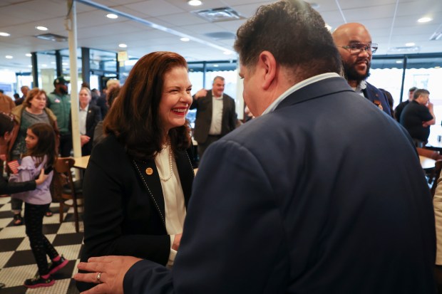 Cook County state's attorney Democratic candidate Eileen O'Neill Burke speaks with Gov. J.B. Pritzker at Manny's Deli in the West Loop on Election Day. (Eileen T. Meslar/Chicago Tribune)