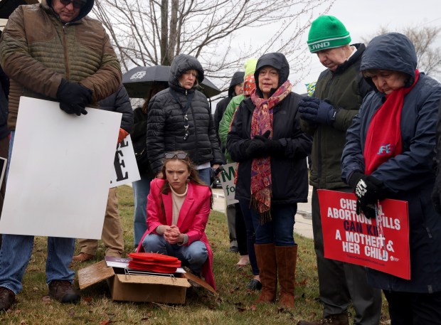 Anti-abortion activists led by the Pro-Life Action League rally outside of Walgreens national headquarters, March 26, in Deerfield. (Stacey Wescott/Chicago Tribune)