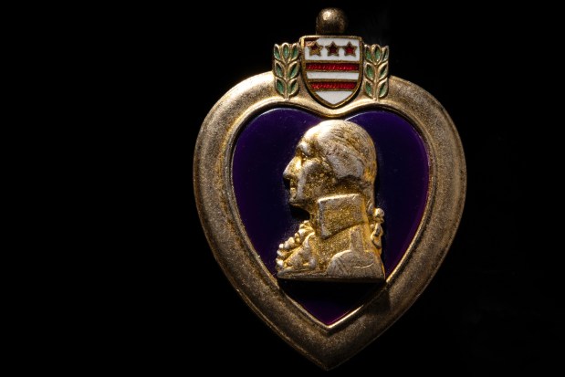 The Purple Heart medal awarded to U.S. Marine Cpl. Delbert Tuttle. (E. Jason Wambsgans/Chicago Tribune)