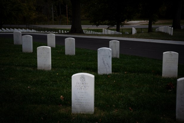 The grave marker for WWII veteran Delbert Tuttle at Camp Butler National Cemetery near Springfield is marked "SS-PH" for his Silver Star and Purple Heart. (E. Jason Wambsgans/Chicago Tribune)