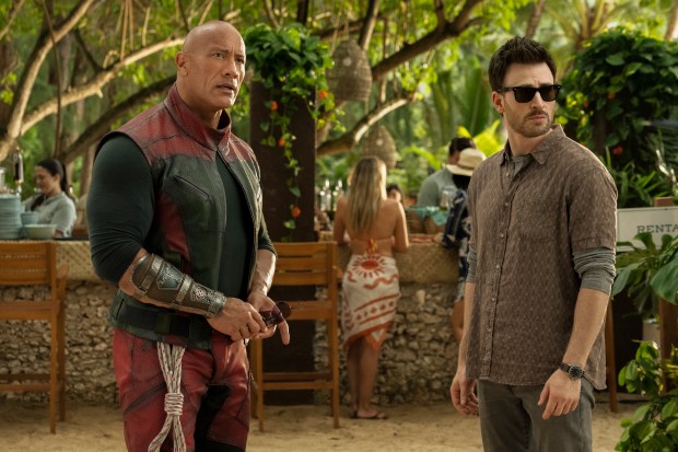 Santa's paramilitary security officer (Dwayne Johnson, left) teams up with a self-loathing surveillance expert (Chris Evans) to save Christmas in "Red One." (Karen Neal/Prime)