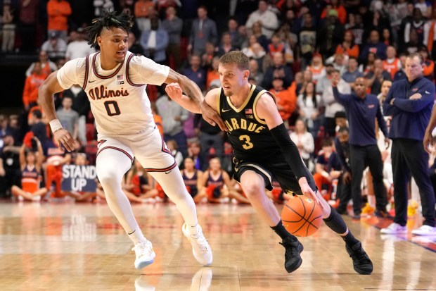 Purdue's Braden Smith drives to the basket as Illinois' Terrence Shannon Jr. defends on March 5, 2024, in Champaign. (AP Photo/Charles Rex Arbogast)