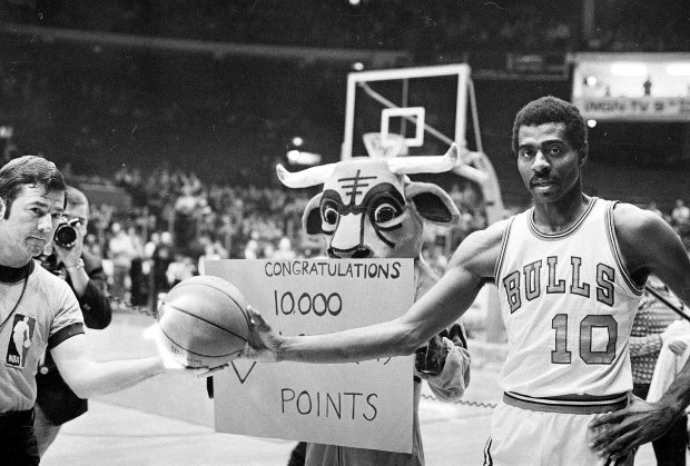 Chicago Bulls' Bob Love is presented with the game ball in Chicago on Jan. 25, 1974, after he scored his 10,000th career point, during a game against the Seattle SuperSonics. (AP Photo/File)