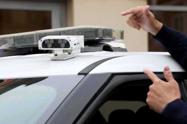 An automatic camera on a city vehicle is shown at a press conference at Chicago and Milwaukee avenues, Nov. 4, 2024, for a pilot program called Smart Streets. (Antonio Perez/Chicago Tribune)