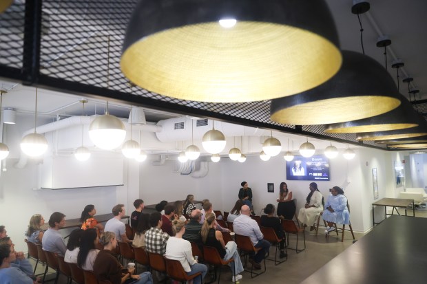 Employees attend a Basis Conversations meeting at Basis Technologies on Sept. 12, 2024. (Talia Sprague/for the Chicago Tribune)