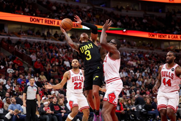 Chicago Bulls forward Jalen Smith (7) guards Utah Jazz guard Keyonte George (3) while he goes up for a basket during the first quarter at the United Center Monday Nov. 4, 2024, in Chicago. (Armando L. Sanchez/Chicago Tribune)