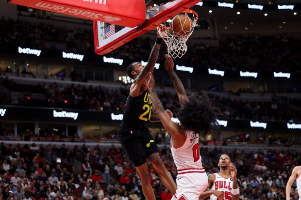 Utah Jazz forward John Collins (20) dunks on Chicago Bulls guard Coby White (0) during the second quarter at the United Center Monday Nov. 4, 2024, in Chicago. (Armando L. Sanchez/Chicago Tribune)