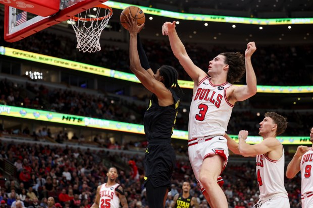 Utah Jazz forward Cody Williams (5) goes up for a basket past Chicago Bulls guard Josh Giddey (3) during the second quarter at the United Center Monday Nov. 4, 2024, in Chicago. (Armando L. Sanchez/Chicago Tribune)