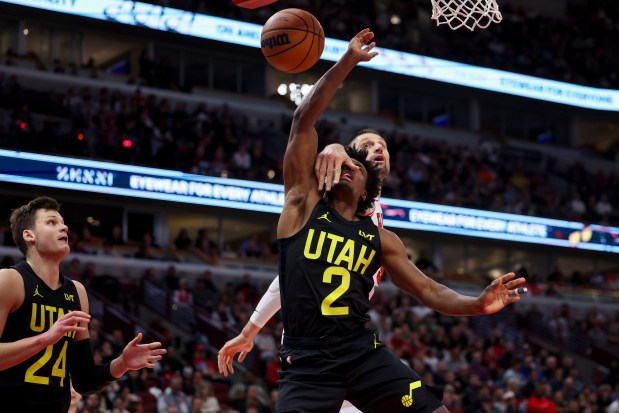 Chicago Bulls center Nikola Vucevic (9) fouls Utah Jazz guard Collin Sexton (2) during the second quarter at the United Center Monday Nov. 4, 2024, in Chicago. (Armando L. Sanchez/Chicago Tribune)