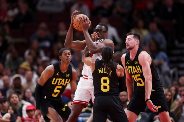 Utah Jazz forward Cody Williams (5), Utah Jazz guard Patty Mills (8), and Utah Jazz forward Drew Eubanks (15) guard Chicago Bulls forward Jalen Smith (7) during the second quarter at the United Center Monday Nov. 4, 2024, in Chicago. (Armando L. Sanchez/Chicago Tribune)