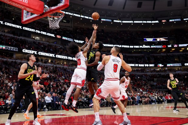 Chicago Bulls guard Coby White (0) guards Utah Jazz guard Collin Sexton (2) while he goes up for a shot during the first quarter at the United Center Monday Nov. 4, 2024, in Chicago. (Armando L. Sanchez/Chicago Tribune)