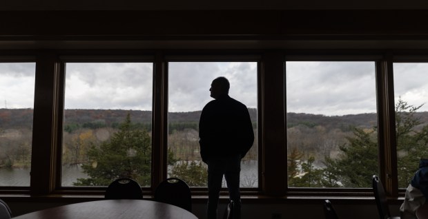 Doug Witt of Rochelle, looks out the window of Lorado Taft's dining hall on Nov. 10, 2024. (Troy Stolt/for the Chicago Tribune)