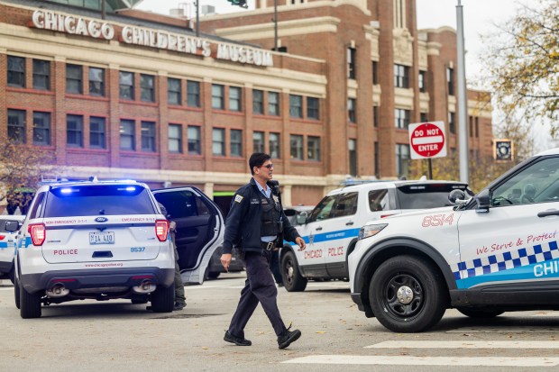 Police investigate the scene after two people were shot near the north side of Navy Pier in Chicago on Nov. 5, 2024. (Tess Crowley/Chicago Tribune)