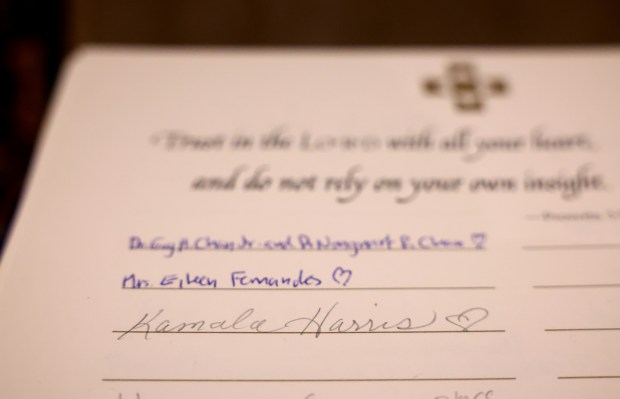 Kamala Harris' name is written in a book of names to be prayed for during a special Election Day Mass at Saint Clement Church in Chicago's Lincoln Park neighborhood on Nov. 5, 2024. (Chris Sweda/Chicago Tribune)