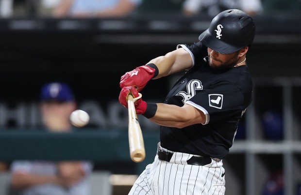 Chicago White Sox left fielder Andrew Benintendi (23) drives in two runs on a double in the first inning of a game against the Texas Rangers at Guaranteed Rate Field in Chicago on Aug. 28, 2024. (Chris Sweda/Chicago Tribune)